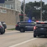 Police vehicles near an intersection blocked off after a Cedar Rapids shooting