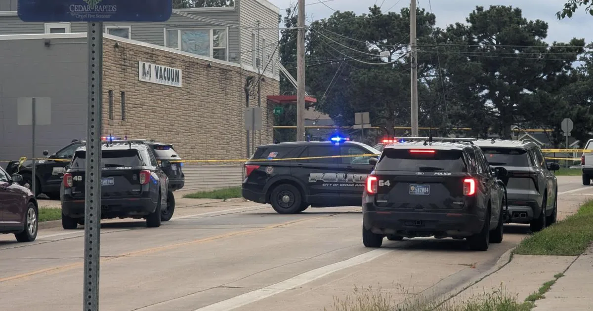 Police vehicles near an intersection blocked off after a Cedar Rapids shooting