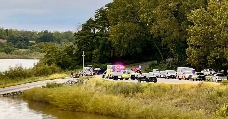 Emergency crews search along the Iowa River in Iowa City after a field trip accident