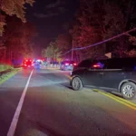 A crash scene in Easton involving a burned work van and a damaged tractor-trailer