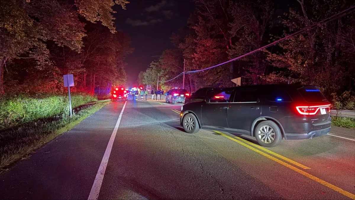 A crash scene in Easton involving a burned work van and a damaged tractor-trailer