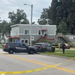 Police tape near a Cedar Rapids street after an officer-involved shooting